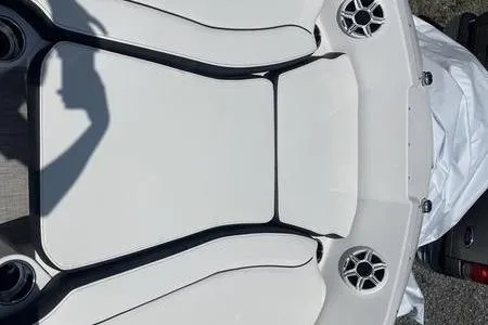 Slide: The Image of 2025 Stingray 182C boat interior with white seating and speaker system. - 9