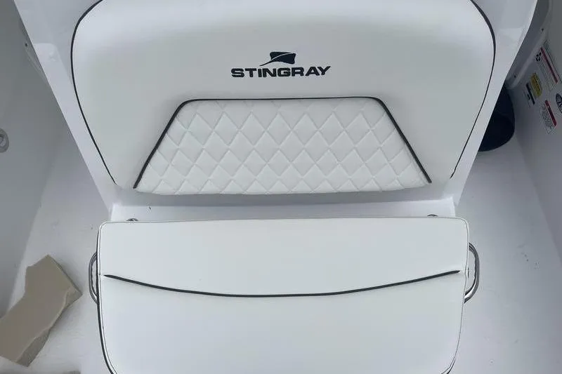 Slide: The Image of 2025 Stingray 173CC boat seat with diamond stitching and logo. - 12