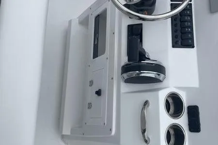 Slide: The Image of 2025 Stingray 173CC boat dashboard with steering wheel and control panel. - 16