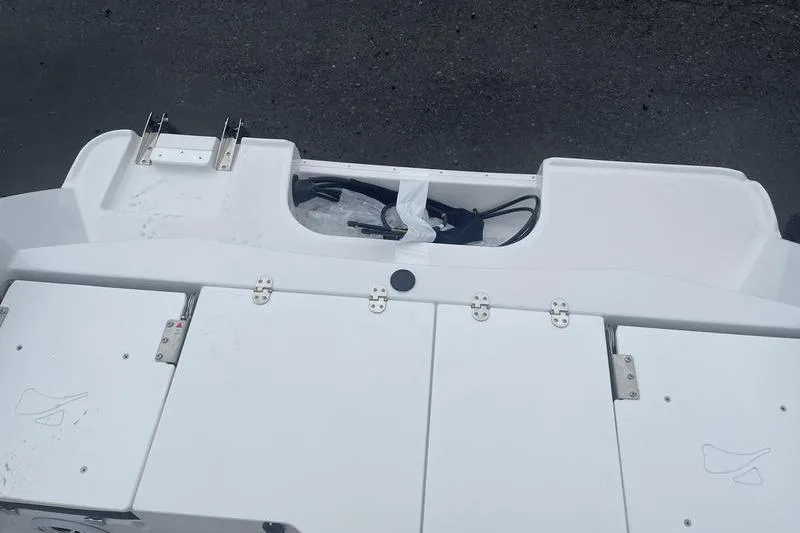 Slide: The Image of 2025 Stingray 173CC boat deck with storage compartments and fittings. - 18
