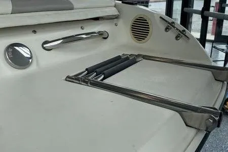 Slide: The Image of 2007 Stingray 195FX boat with stainless steel ladder and speaker on deck. - 11