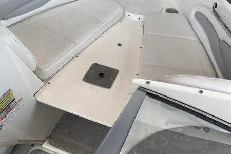 Slide: The Image of 2007 Stingray 195FX boat interior with white seating and deck area. - 15