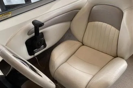 Slide: The Image of 2007 Stingray 195FX boat interior with beige leather seat and steering wheel. - 18