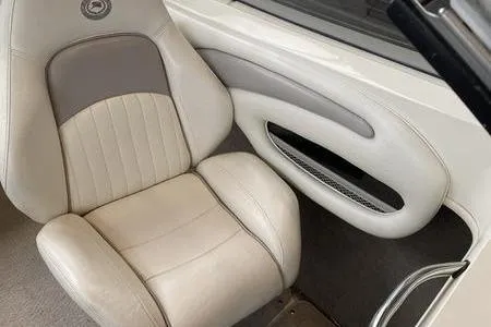 Slide: The Image of 2007 Stingray 195FX boat interior with beige and gray seating. - 19