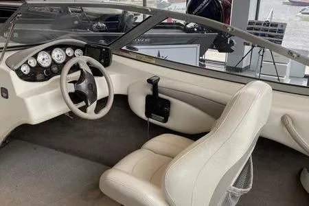 Slide: The Image of Interior of a 2007 Stingray 195FX boat featuring steering wheel and dashboard controls. - 20