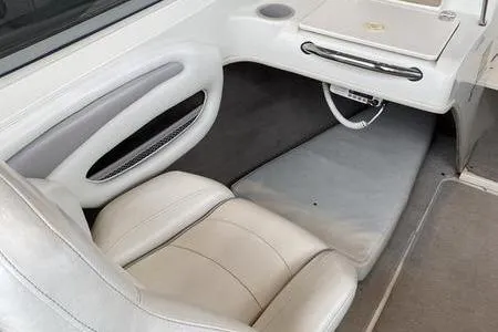 Slide: The Image of 2007 Stingray 195FX boat interior with white seating and dashboard details. - 21