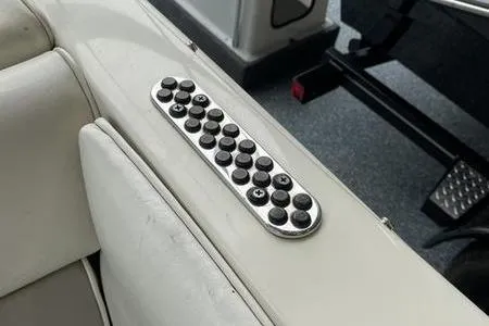 Slide: The Image of Control panel on a 2007 Stingray 195FX boat interior, featuring multiple buttons. - 22