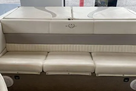 Slide: The Image of 2007 Stingray 195FX boat interior with beige seating and storage compartments. - 24