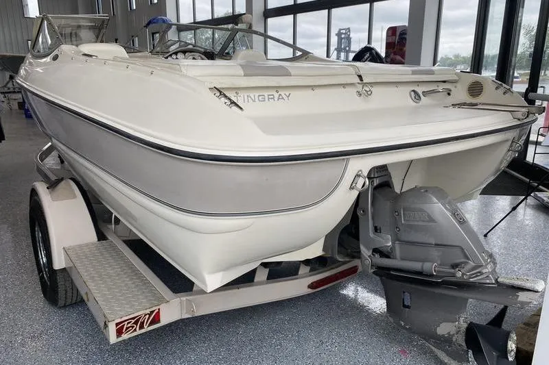 Slide: The Image of 2007 Stingray 195FX boat on trailer in showroom, rear view. - 6