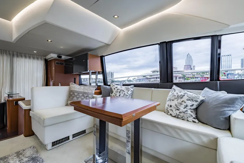 Slide: The Image of Luxurious interior of 2013 Prestige 500 Fly yacht with elegant seating and cityscape view. - 17