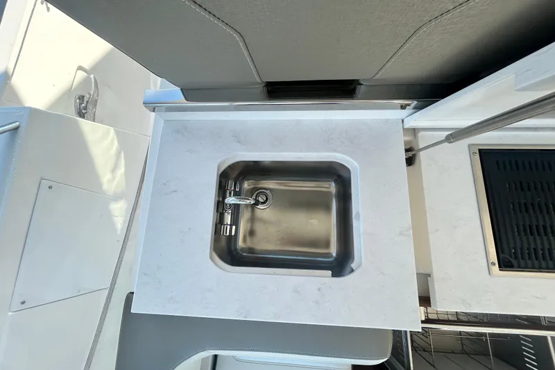 Slide: The Image of 2023 Tiara Yachts 38 LS yacht sink with modern countertop design. - 24