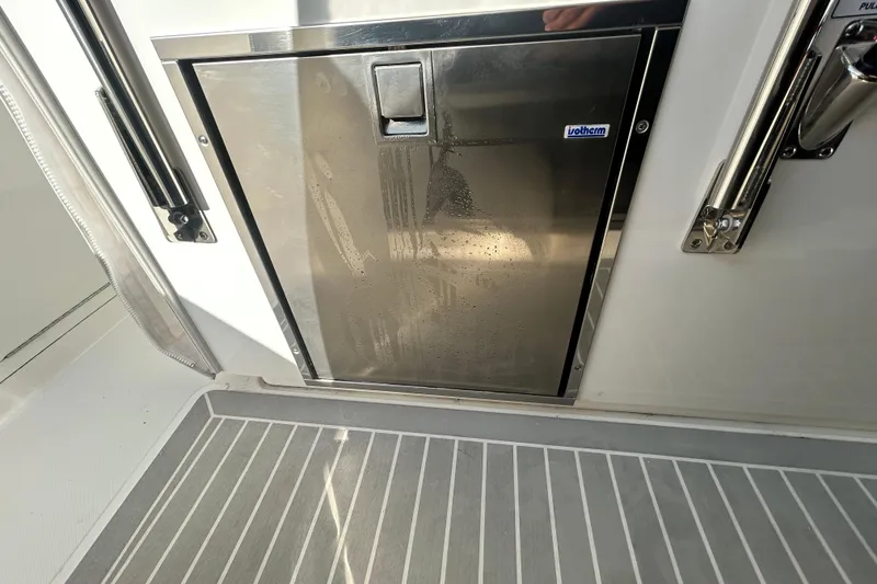 Slide: The Image of Stainless steel door on 2023 Tiara Yachts 38 LS, featuring a sleek design. - 28