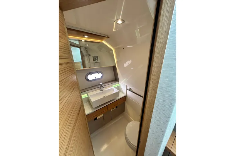 Slide: The Image of Luxurious bathroom interior of 2023 Tiara Yachts 38 LS with modern fixtures and lighting. - 35
