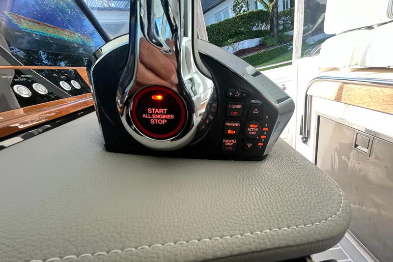 Slide: The Image of 2023 Tiara Yachts 38 LS engine control panel with start/stop button and various controls. - 42