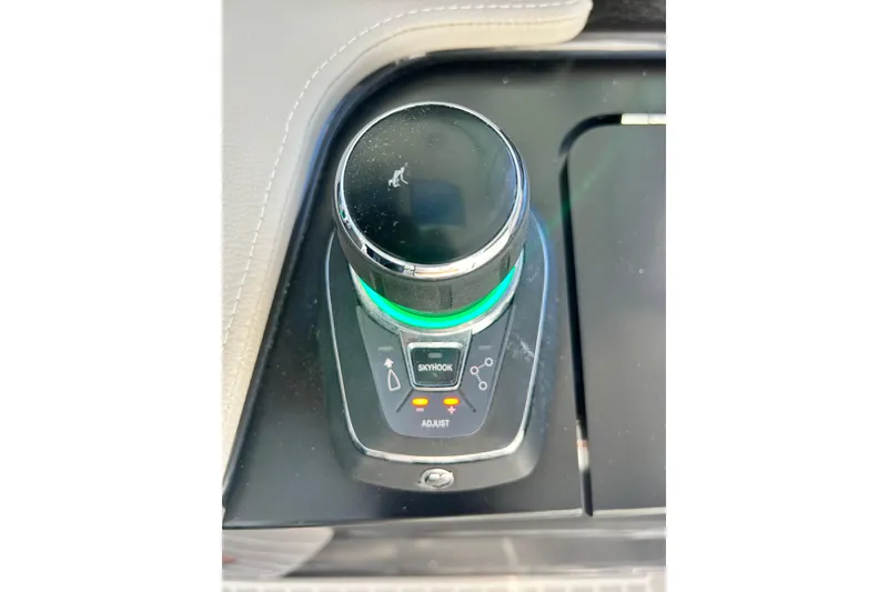 Slide: The Image of Control knob on 2023 Tiara Yachts 38 LS dashboard, featuring adjustment and Skyhook options. - 43