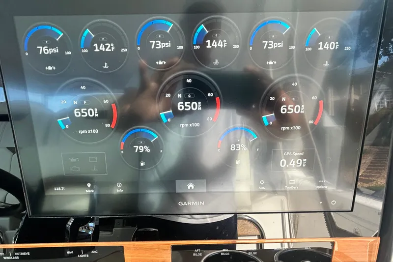 Slide: The Image of Dashboard of 2023 Tiara Yachts 38 LS showing engine metrics and GPS speed. - 44