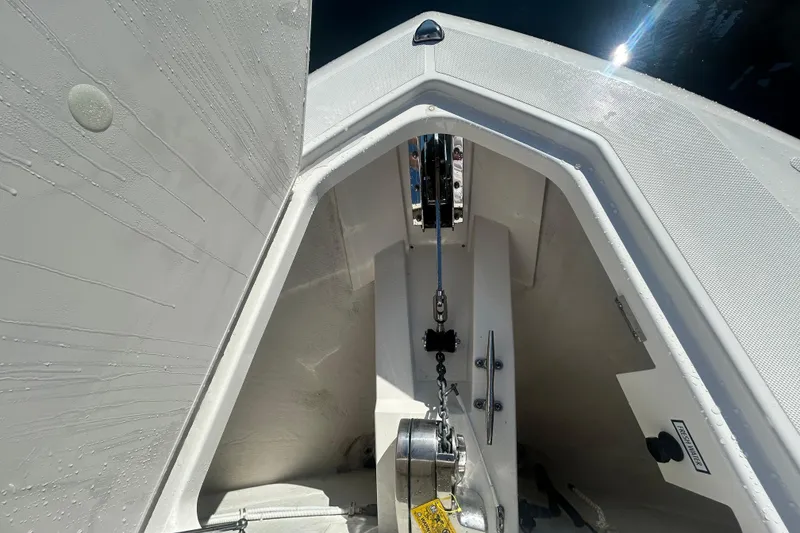 Slide: The Image of 2023 Tiara Yachts 38 LS anchor compartment with chain and winch system. - 47