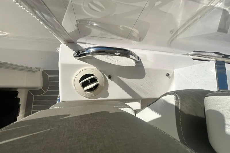 Slide: The Image of 2023 Tiara Yachts 38 LS interior detail with chrome handle and air vent. - 52