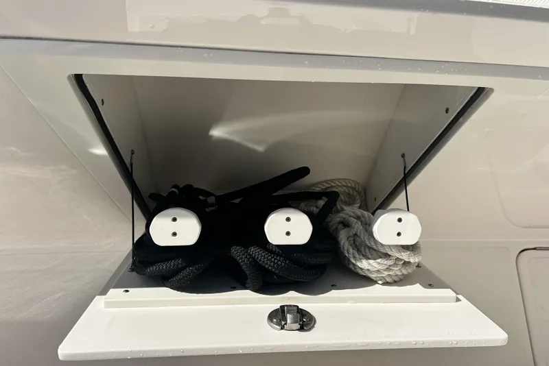 Slide: The Image of Storage compartment with ropes on a 2023 Tiara Yachts 38 LS. - 56