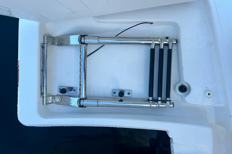 Slide: The Image of 2023 Tiara Yachts 38 LS swim platform with retractable ladder. - 58