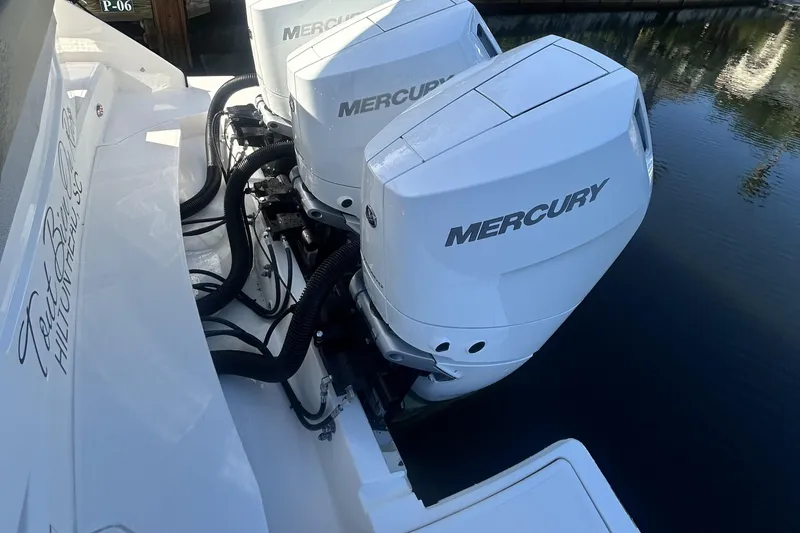 Slide: The Image of 2023 Tiara Yachts 38 LS with dual Mercury outboard engines on water. - 59