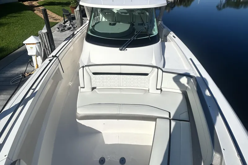 Slide: The Image of 2023 Tiara Yachts 38 LS boat with spacious seating and sleek design. - 7