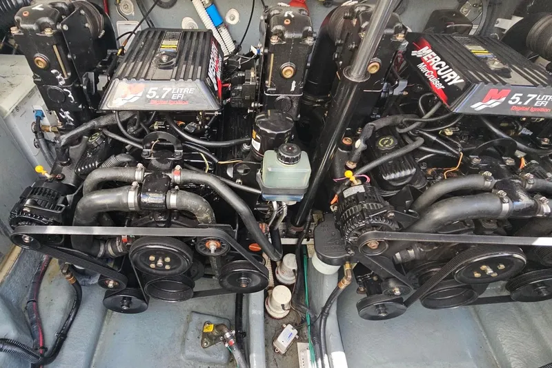 Slide: The Image of Engine compartment of a 2002 Sea Ray 300 Sundancer with twin 5.7L EFI engines. - 8