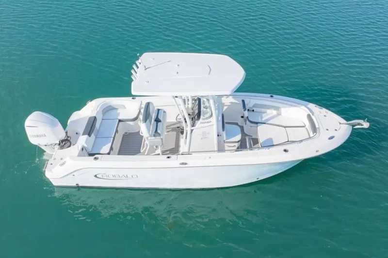 The Image of 2019 Robalo R242 Explorer boat on clear blue water, aerial view. - 0