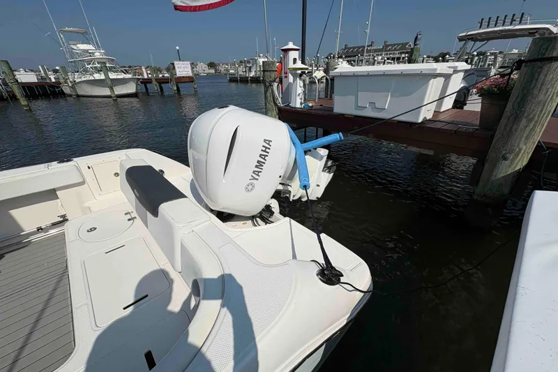 Slide: The Image of 2019 Robalo R242 Explorer with Yamaha outboard engine docked at marina. - 12