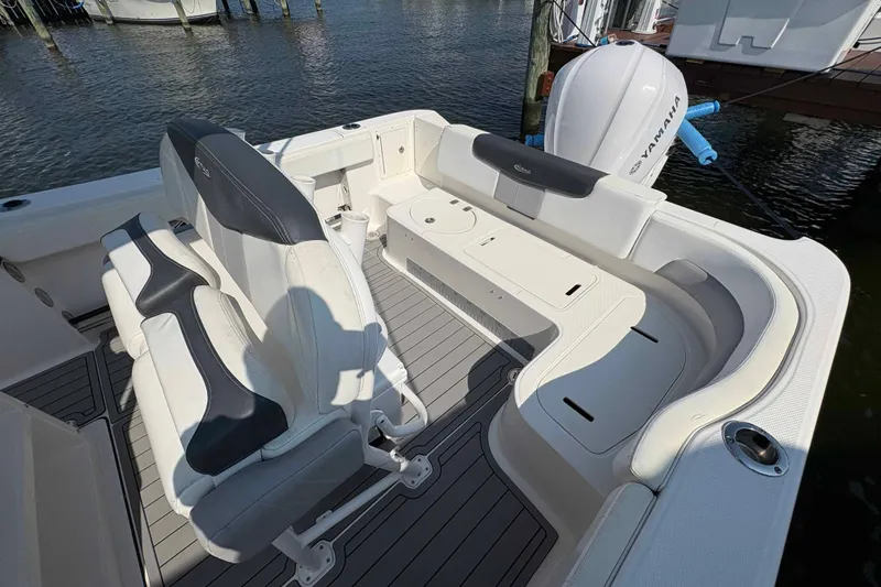 Slide: The Image of 2019 Robalo R242 Explorer boat interior with seating and Yamaha engine. - 9