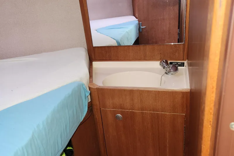 Slide: The Image of Interior of 1996 Hunter 376 sailboat with sink and bed. - 10