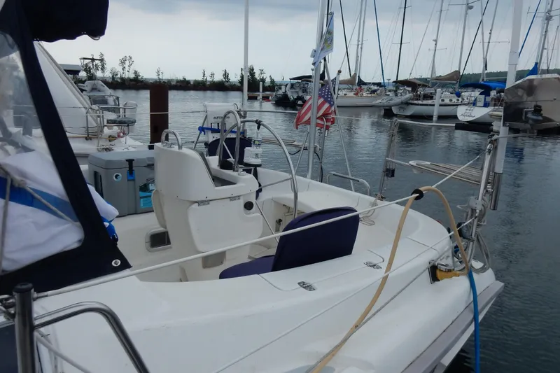 Slide: The Image of Sailboat docked in marina, Hunter 376 model, 1996, with American flag. - 22