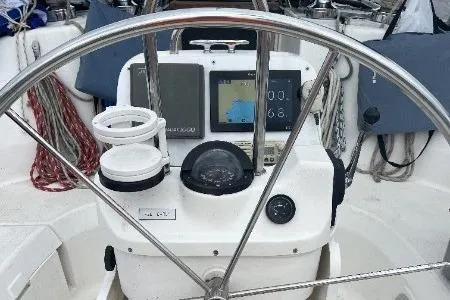 Slide: The Image of Steering wheel and navigation instruments on a 1996 Hunter 376 sailboat. - 23