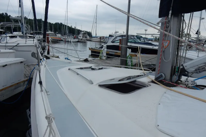 Slide: The Image of Sailboat docked at marina, Hunter 376 model, 1996, surrounded by other boats. - 24