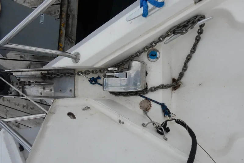 Slide: The Image of Anchor chain and windlass on 1996 Hunter 376 sailboat deck. - 29