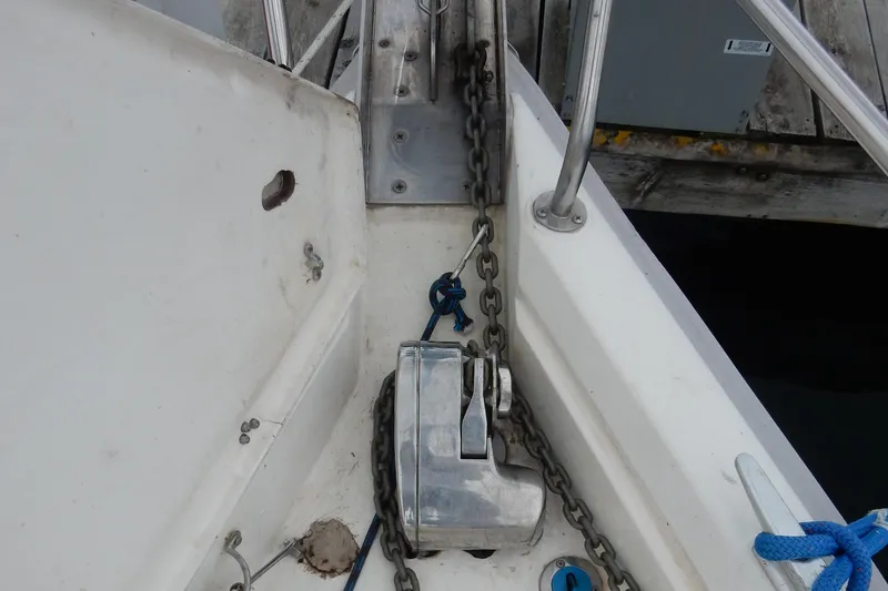 Slide: The Image of Anchor chain and windlass on a 1996 Hunter 376 sailboat deck. - 30
