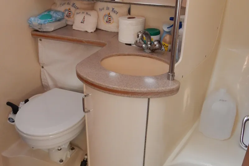 Slide: The Image of Bathroom interior of a 1996 Hunter 376 sailboat with sink and toilet. - 33