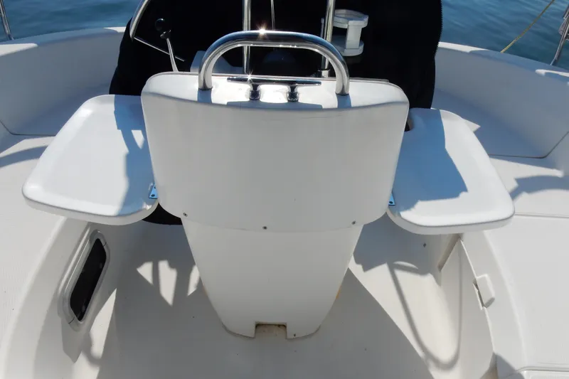 Slide: The Image of Cockpit of 1996 Hunter 376 sailboat with dual folding tables and steering wheel. - 40