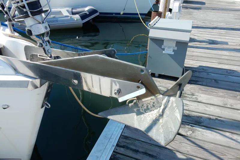 Slide: The Image of Anchor on a 1996 Hunter 376 sailboat docked at a marina. - 41