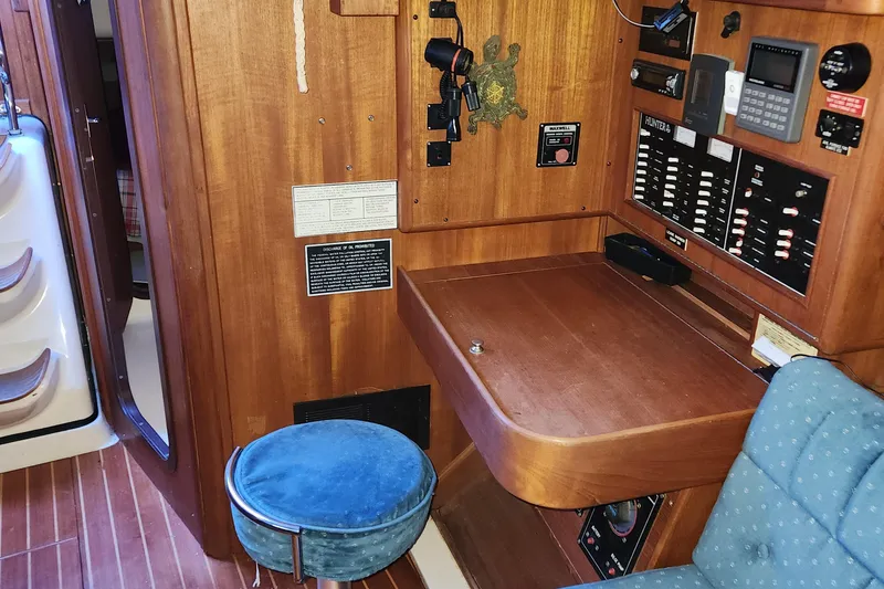 Slide: The Image of 1996 Hunter 376 yacht interior with navigation station and control panel. - 7