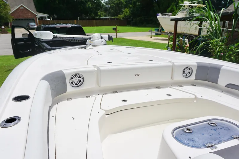 Slide: The Image of 2019 Tidewater 2700 Carolina Bay boat interior with speakers and storage compartments. - 12