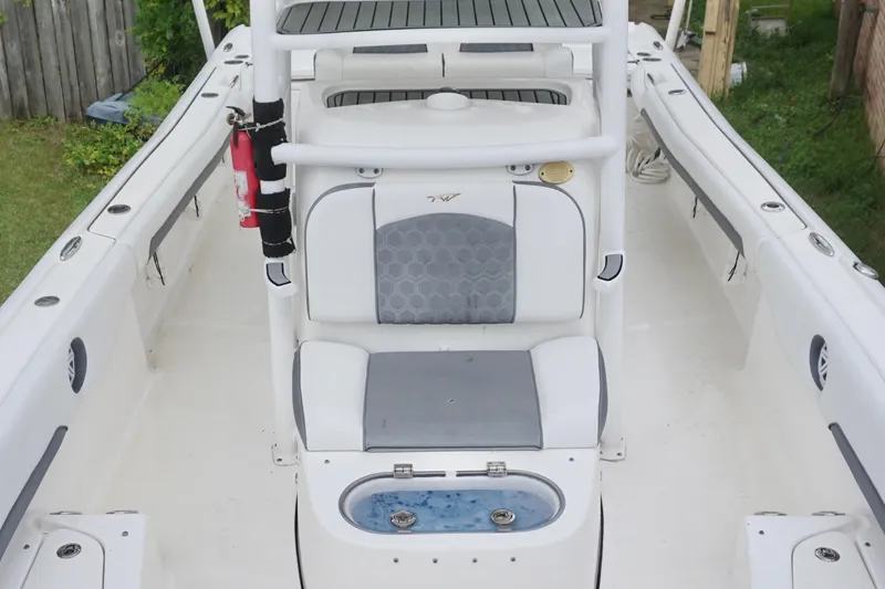 Slide: The Image of 2019 Tidewater 2700 Carolina Bay boat interior with seating and storage compartments. - 13