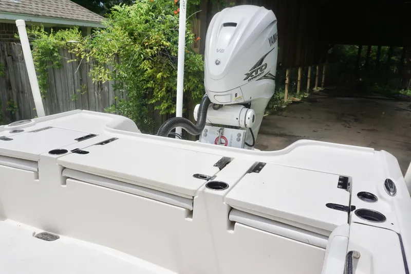 Slide: The Image of 2019 Tidewater 2700 Carolina Bay boat with Yamaha XTO engine in a backyard setting. - 15