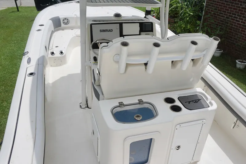Slide: The Image of 2019 Tidewater 2700 Carolina Bay boat interior with fishing rod holders and Simrad navigation system. - 21