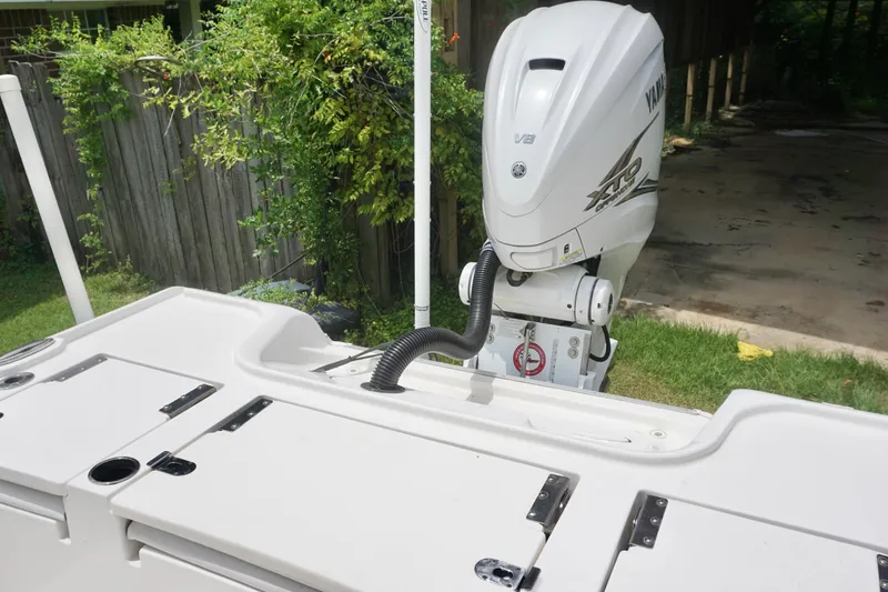 Slide: The Image of 2019 Tidewater 2700 Carolina Bay boat with Yamaha XTO V8 engine, docked outdoors. - 24