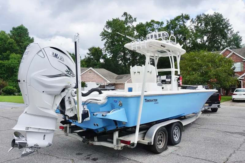 Slide: The Image of 2019 Tidewater 2700 Carolina Bay boat on trailer, featuring Yamaha outboard motor. - 6