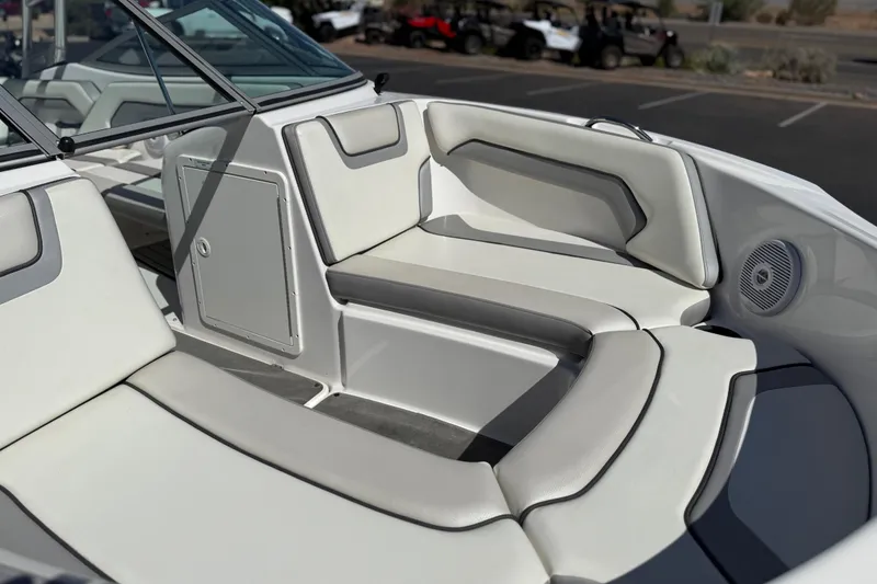 Slide: The Image of 2017 Yamaha AR190 boat interior with white cushioned seating and speaker. - 13