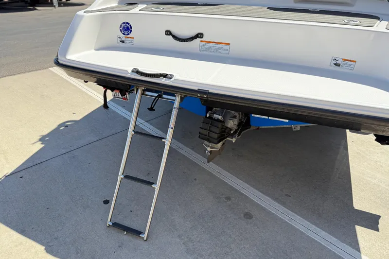 Slide: The Image of 2017 Yamaha Boats AR190 with extended swim platform and ladder on concrete surface. - 18