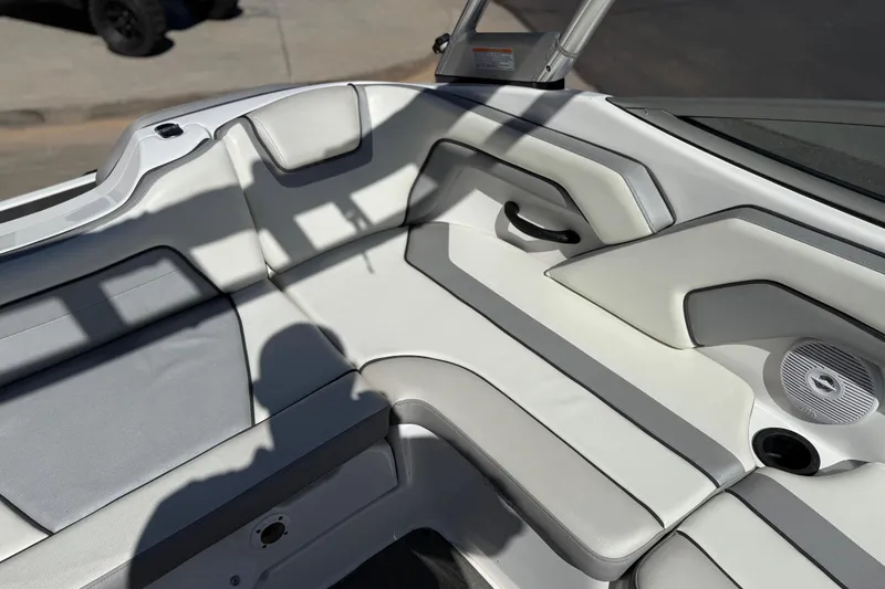 Slide: The Image of 2017 Yamaha AR190 boat interior with white and gray seating and speaker. - 26