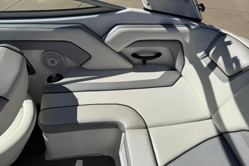 Slide: The Image of 2017 Yamaha AR190 boat interior with cushioned seating and speaker. - 28